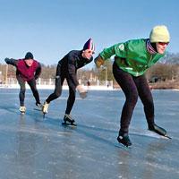 Marathon skaters (L-R) Joe Von Drasek, Hugo Bruggeman and Mary O'Donnell work out on the ice at Lake of the Isles in preparation for the U.S. Skating Marathon Championships.